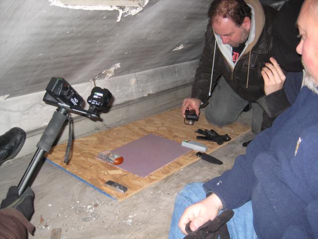 Anthony, Joey, and Gerard conducting EVP session with heat signature pad, audio-visual recording devices, and EMF meters